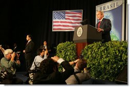 The media swarms President George W. Bush Saturday, Nov. 6, 2005, as he speaks at Blue Tree Stars Hall in Brasilia, Brazil, prior to his departure for Panama. White House photo by Krisanne Johnson