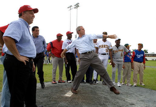 President George W. Bush delivers a pitch from the mound during a baseball event with Major League baseball players and Panamanian youth, Monday, Nov. 7, 2005 in Panama City, Panama. White House photo by Eric Draper