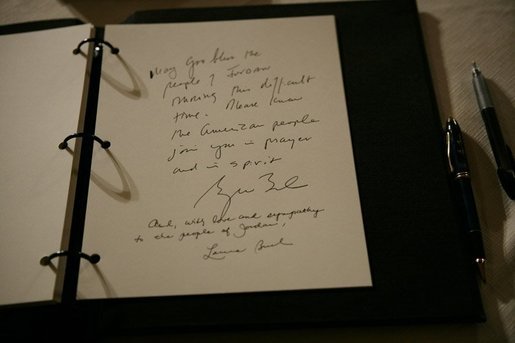 The sympathies of President George W. Bush and Mrs. Laura Bush, are seen written in a book of condolence for the people of Jordan, Thursday, Nov. 10, 2005 at the Embassy of Jordan in Washington. White House photo by Eric Draper