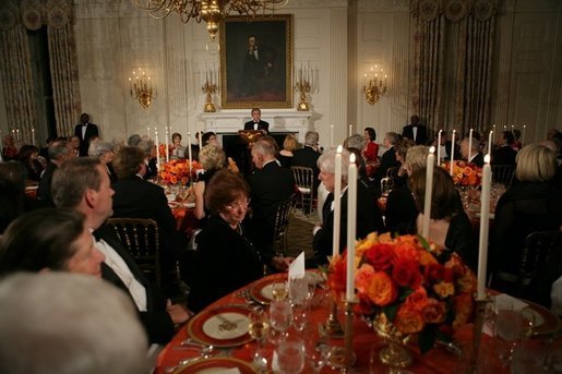 President George W. Bush welcomes guests in the State Dining Room of the White House, Thursday, Nov. 10, 2005, at the dinner celebrating the 40th Anniversary of the National Endowment for the Arts and the National Endowment for the Humanities. White House photo by Paul Morse