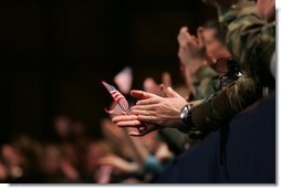 An American flag is highlighted in the crowd Monday, Nov. 14, 2005, as President George W. Bush speaks at Elmendorf Air Force Base in Anchorage on the War on Terror.  White House photo by Shealah Craighead