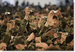 A sea of cameras and hands greet President Bush upon his arrival Saturday, Nov. 19, 2005, to Osan Air Base in Osan, Korea.  White House photo by Eric Draper