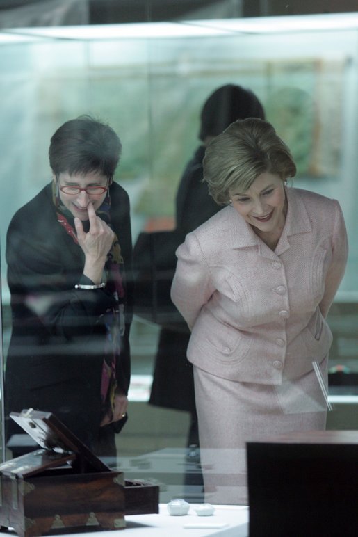 Laura Bush and Lisa Vershbow, left, wife of Alexander Vershbow, the U.S. Ambassador to Korea, look at exhibits at the Busan Museum Saturday, Nov. 19, 2005, in Busan, Korea. White House photo by Shealah Craighead