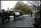 Laura Bush welcomes the arrival of the official White House Christmas tree delivered, Monday, Nov. 28, 2005, on a horse drawn wagon. This year's tree, donated by the Deal Family of Smokey Holler Tree Farm in Laurel Springs, N.C., is the 40th year the National Christmas Tree Growers Association has provided a tree to the White House. White House photo by Shealah Craighead