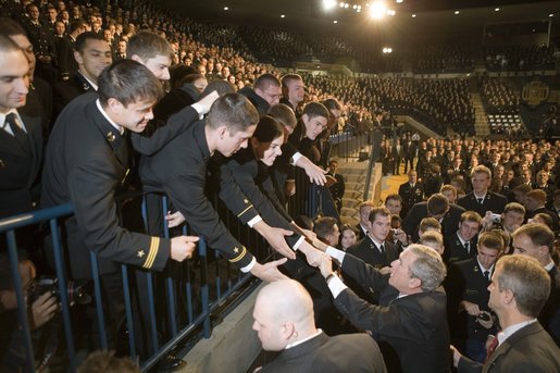 President George W. Bush reaches out to Midshipmen at the United States Naval Academy Wednesday, Nov. 30, 2005, in Annapolis, Maryland, where he spoke on the War on Terror. The President thanked the Midshipmen for volunteering to serve and told them America is grateful for their devotion to duty. White House photo by Paul Morse