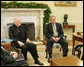 President George W. Bush meets with Theodore Cardinal McCarrick, Archbishop of Washington, Thursday, Dec. 1, 2005, in the Oval Office at the White House. White House photo by Paul Morse