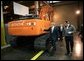 President George W. Bush tours the John Deere-Hitachi excavator assembly line, Monday, Dec. 5, 2005 with operations manager Ron Morrison, prior to his remarks on the economy and tax relief to an audience in Kernersville, N.C. White House photo by Eric Draper