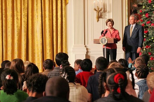 Laura and President Bush welcome children to the White House's Children's Holiday Reception in the East Room Monday, Dec. 5, 2005. White House photo by Shealah Craighead