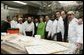 Mrs. Laura Bush is joined by Rabbi Binyomin Taub, Rabbi Hillel Baron and Rabbi Mendy Minkowitz as they stand with staff Tuesday, Dec. 6, 2005, during the kosherizing of the White House kitchen. White House photo by Shealah Craighead