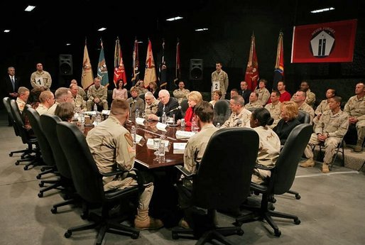 Vice President Dick Cheney and Lynne Cheney sit down and talk with troops from the 42nd Infantry at Fort Drum, N.Y., Tuesday, Dec. 6, 2005. White House photo by David Bohrer