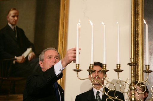 President George W. Bush participates in the Menorah lighting at the White House with Rabbi Joshua Skoff and members of the Skoff family, Tuesday, Dec. 6, 2005, prior to the annual White House Hanukkah reception. White House photo by Kimberlee Hewitt