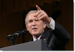 President George W. Bush points to a member of the audience during a question and answer segment, after delivering remarks on the War on Terror before members of the World Affairs Council of Philadelphia, Monday, Dec. 12, 2005.  White House photo by Eric Draper