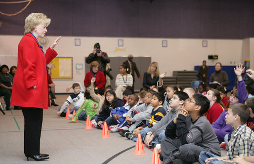 Students at Fort Belvoir Elementary School fill the gymnasium Tuesday, Dec. 13, 2005, for a visit by Mrs. Lynne Cheney. Mrs. Cheney spoke with the kids about the importance of the upcoming Iraqi elections and likened the parliamentary procedure to that of America's in its own early struggle for democracy. White House photo by David Bohrer