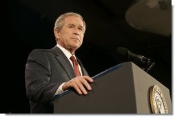 President Bush acknowledges applause during his remarks on the War on Terror Wednesday, Dec. 14, 2005, at the Woodrow Wilson International Center for Scholars in Washington D.C. Speaking of this week's elections in Iraq, President Bush told the audience, "We are living through a watershed moment in the story of freedom."  White House photo by Kimberlee Hewitt