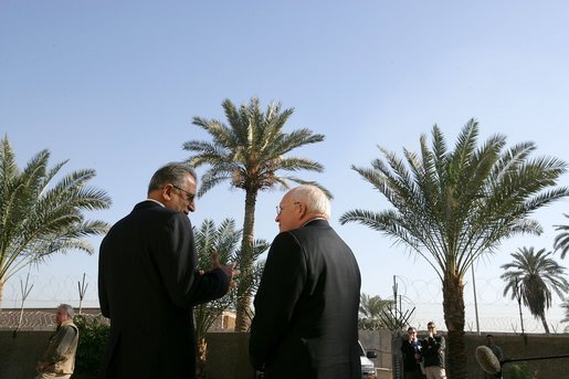 Vice President Dick Cheney speaks with Zalmay Khalilzad, US Ambassador to Iraq, inside the Green Zone, Sunday Dec. 18, 2005. White House photo by David Bohrer