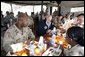 Vice President Dick Cheney has lunch with US and Iraqi troops at the 9th Mechanized Infantry Division Headquarters, a training facility for Iraqi troops, Sunday Dec 18, 2005. White House photo by David Bohrer