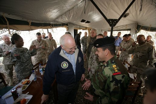 Vice President Dick Cheney has lunch with US and Iraqi troops at the 9th Mechanized Infantry Division Headquarters, a training facility for Iraqi troops, Sunday Dec 18, 2005. White House photo by David Bohrer