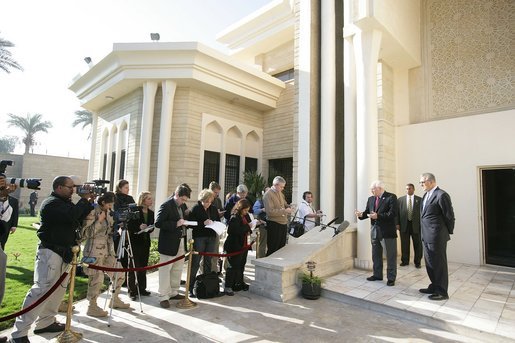 Vice President Dick Cheney, accompanied by US Ambassador to Iraq Zalmay Khalilzad, takes questions from the press following a meeting inside the Green Zone with General George Casey and General John Abizaid, Sunday Dec. 18, 2005. White House photo by David Bohrer