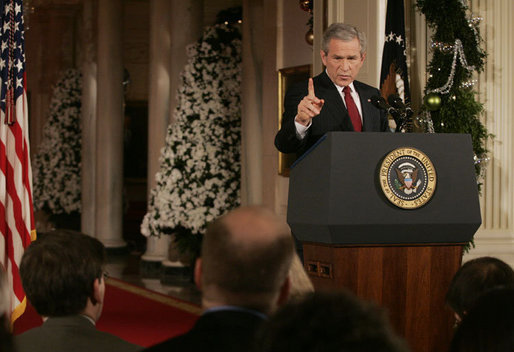 President George W. Bush emphasizes a point as he responds to a reporter's question Monday, Dec. 19, 2005, during a news conference in the East Room of the White House. White House photo by Kimberlee Hewitt