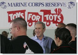 President George W. Bush meets with U.S. Marines working Monday, Dec. 19, 2005 at the "Toys for Tots" collection center at the Naval District Washington Anacostia Annex in Washington, D.C. White House photo by Kimberlee Hewitt