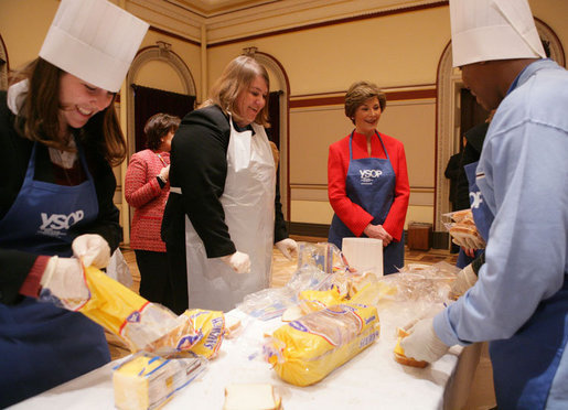 Student participants in the Youth Service Opportunities Project of Washington, D.C.'s Cardozo Senior High School joined Mrs. Laura Bush and her staff, Monday, Dec. 19, 2005, in assembling sandwiches for Martha's Table's mobile soup kitchen. White House photo by Shealah Craighead