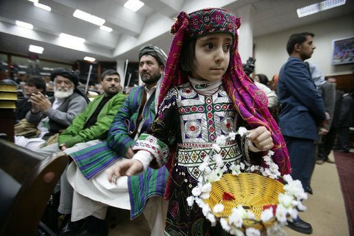 Local children participate in the opening session of the Afghan Parliament, the first elected parliament in more than three decades, in Kabul, Afghanistan Monday, Dec. 19, 2005. White House photo by David Bohrer