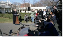 President George W. Bush speaks to reporters on the South Lawn of the White House Wednesday, Dec. 21, 2005, before boarding Marine One for Maryland. Urging Senate to reauthorize the Patriot Act and pass the defense bill, the President said, "There is an enemy that lurks, a dangerous group of people that want to do harm to the American people. and we must have the tools necessary to protect the American people. "  White House photo by Kimberlee Hewitt