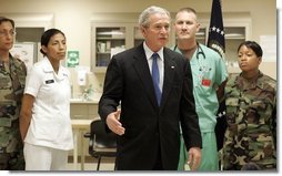 President George W. Bush speaks with the press on Sunday, January 1, 2006, at Brooke Army Medical Center in San Antonio, TX. During his visit to the Medical Center, the President presented nine soldiers with a Purple Heart Award and visited with wounded soldiers and their families.  White House photo by Shealah Craighead