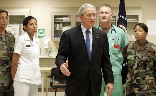 President George W. Bush speaks with the press on Sunday, January 1, 2006, at Brooke Army Medical Center in San Antonio, TX. During his visit to the Medical Center, the President presented nine soldiers with a Purple Heart Award and visited with wounded soldiers and their families. White House photo by Shealah Craighead