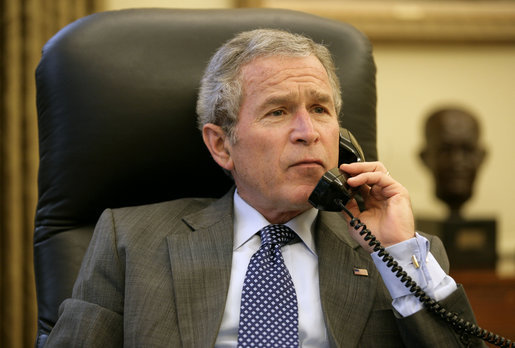 President George W. Bush and West Virginia Governor Joe Manchin discuss the rescue efforts to save miners trapped in a Tallmansville, W. Va. mine, during a phone call from the Oval Office Tuesday, Jan. 3, 2006. White House photo by Eric Draper