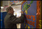 President George W. Bush signs a classroom door during his visit with teachers and students at North Glen Elementary School in Glen Burnie, Md., Monday, Jan. 9, 2006. White House photo by Kimberlee Hewitt