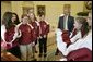 President George W. Bush hosts a visit to the Oval Office by the 2005 Little League Softball World Series Champions Tuesday, Jan. 10, 2006. The All-Star team of 11- and 12-year-old girls is based in McLean, Va., and represents the South Region of the United States. White House photo by Eric Draper