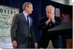 President George W. Bush and Mississippi Gov. Haley Barbour stand together at St. Stanislaus College in Bay St. Louis, Miss., Thursday, Jan. 12, 2006. "Part of the strategy to make sure that the rebuilding effort after the recovery effort worked well was to say to people like Haley, and the Governor of Louisiana and the Mayor of New Orleans, you all develop a strategy," said the President. "It's your state, it's your region, you know the people better than people in Washington -- develop the rebuilding strategy. And the role of the federal government is to coordinate with you and to help."  White House photo by Eric Draper