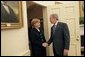 President George W. Bush welcomes German Chancellor Angela Merkel to the Oval Office Friday, Jan. 13, 2006. It is Chancellor Merkel's first visit to the White House. White House photo by Eric Draper