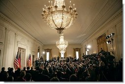 The East Room of the White House is filled as President George W. Bush and German Chancellor Angela Merkel deliver remarks during a joint press availability Friday, Jan. 13, 2006.  White House photo by Eric Draper