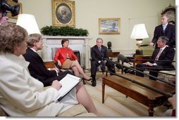 President George W. Bush meets with business leaders to discuss Central American Relief and Reconstruction Efforts in the Oval Office Friday, Jan. 13, 2006. From left, they are: Robert Lane of Deer & Co., Maria Elena Lagomasino of Asset Management Advisors, LLC., and Steve Reinmund of PepsiCo. Under Secretary of State Karen Hughes is pictured at the far left.  White House photo by Paul Morse