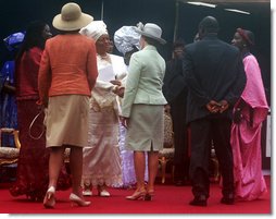 Mrs. Laura Bush, center, and U.S. Secretary of State Condoleezza Rice, left-foreground, congratulate Liberian President Ellen Johnson Sirleaf in Monrovia, Liberia, at her inauguration Monday, Jan. 16, 2006. President Sirleaf is Africa's first female elected head of state. White House photo by Shealah Craighead