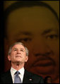 President George W. Bush looks up at the audience while taking the stage before his remarks at Georgetown University's "Let Freedom Ring" Celebration Honoring Dr. Martin Luther King at the John F. Kennedy Center for the Performing Arts, Monday, Jan. 16, 2006. White House photo by Eric Draper