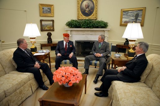 President George W. Bush meets with Tom Bock, the national commander of the American Legion, in the Oval Office Tuesday, Jan. 17, 2006. Also pictured, from left, are: John Sommer, executive director of the American Legion's Washington office, and Jim Nicholson, Secretary of Veterans Affairs. White House photo by Paul Morse