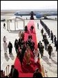 Followed by a group of Saudi and US delegates, Vice President Dick Cheney walks down a red carpet with Prince Saud al-Faisal bin Abdulaziz, Saudi Minister of Foreign Affairs, upon arrival to King Khalid International Airport in Saudi Arabia, Tuesday January 17, 2006. White House photo by David Bohrer