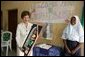 Laura Bush admires a gift presented to her at the conclusion of her visit to the Model Secondary School in Abuja, Nigeria, January 18, 2006. White House photo by Shealah Craighead