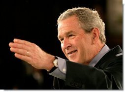 President George W. Bush takes a question from the audience during a discussion about the economy at JK Moving and Storage in Sterling, Va., Thursday, Jan. 19, 2006.  White House photo by Eric Draper