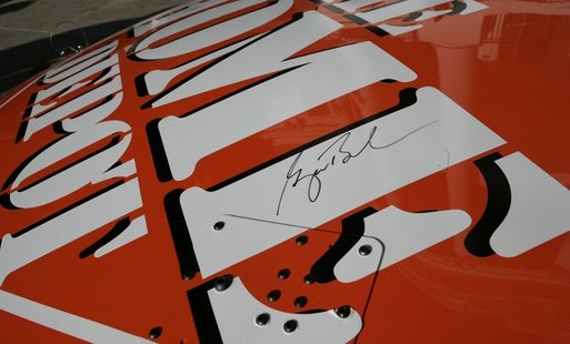 The signature of President George W. Bush is seen written on the hood of the 2005 NASCAR Nextel Cup Champion car, Tuesday, Jan. 24, 2006, during a ceremony honoring the team on the South Lawn of the White House. White House photo by Eric Draper