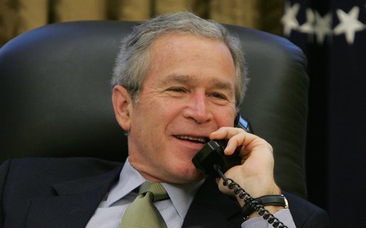 President George W. Bush talks on the phone with Canadian Prime Minister-elect Stephen Harper, in the Oval Office, Wednesday morning, Jan. 25, 2006. White House photo by Paul Morse