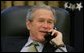 President George W. Bush talks on the phone with Canadian Prime Minister-elect Stephen Harper, in the Oval Office, Wednesday morning, Jan. 25, 2006. White House photo by Paul Morse