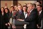 President George W. Bush stands with former law clerks of Judge Samuel Alito as he delivers a statement in the Dwight D. Eisenhower Executive Office Building Wednesday, Jan. 25, 2006. "All these brilliant legal minds are united in their strong support of Sam Alito, And in his confirmation hearings, the American people saw why. Judge Alito is open-minded and principled," said the President. "He gives every case careful attention, and he makes decisions based on the merits. Judge Alito understands that the role of a judge is to interpret the law, not to advance a personal or political agenda." White House photo by Paul Morse