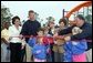 Laura Bush attends a ribbon cutting ceremony with football star Brett Favre and his wife, Deanna, left, Secretary Margaret Spellings, center, Dan Vogel, Associate Director, USA Freedom Corps, right, and student of Hancock North Central Elementary Shool at the Kaboom Playground, built at the Hancock North Central Elementary School in Kiln, Ms., Wednesday, Jan. 26, 2006, during a visit to the area ravaged by Hurricane Katrina. White House photo by Shealah Craighead