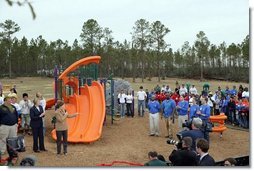 Laura Bush addresses a gathering to dedicate the new Kaboom Playground, built at the Hancock North Central Elementary School in Kiln, Ms., Wednesday, Jan. 26, 2006, during a visit to the area ravaged by Hurricane Katrina.  White House photo by Shealah Craighead