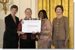 Laura Bush along with Mary Chute, Acting Director, Institute of Museums and Library Services, left, presents the 2005 National Awards for Museum and Library Services awards to St Paul Public Library Director, Kathleen Flynn, and Community Representative, Regina Harris, during a ceremony at the White House January 30, 2006. The Institute of Museum and Library Services’ National Awards for Museum and Library Service honor outstanding museums and libraries that demonstrate an ongoing institutional commitment to public service. It is the nation’s highest honor for excellence in public service provided by these institutions. White House photo by Shealah Craighead