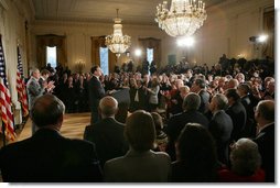 President George W. Bush, left, listens as newly confirmed U.S. Supreme Court Justice Samuel Alito addresses an audience, Tuesday, Feb. 1, 2006 in the East Room of the White House, prior to being sworn-in by U.S. Supreme Court Chief Justice John Roberts. White House photo by Paul Morse